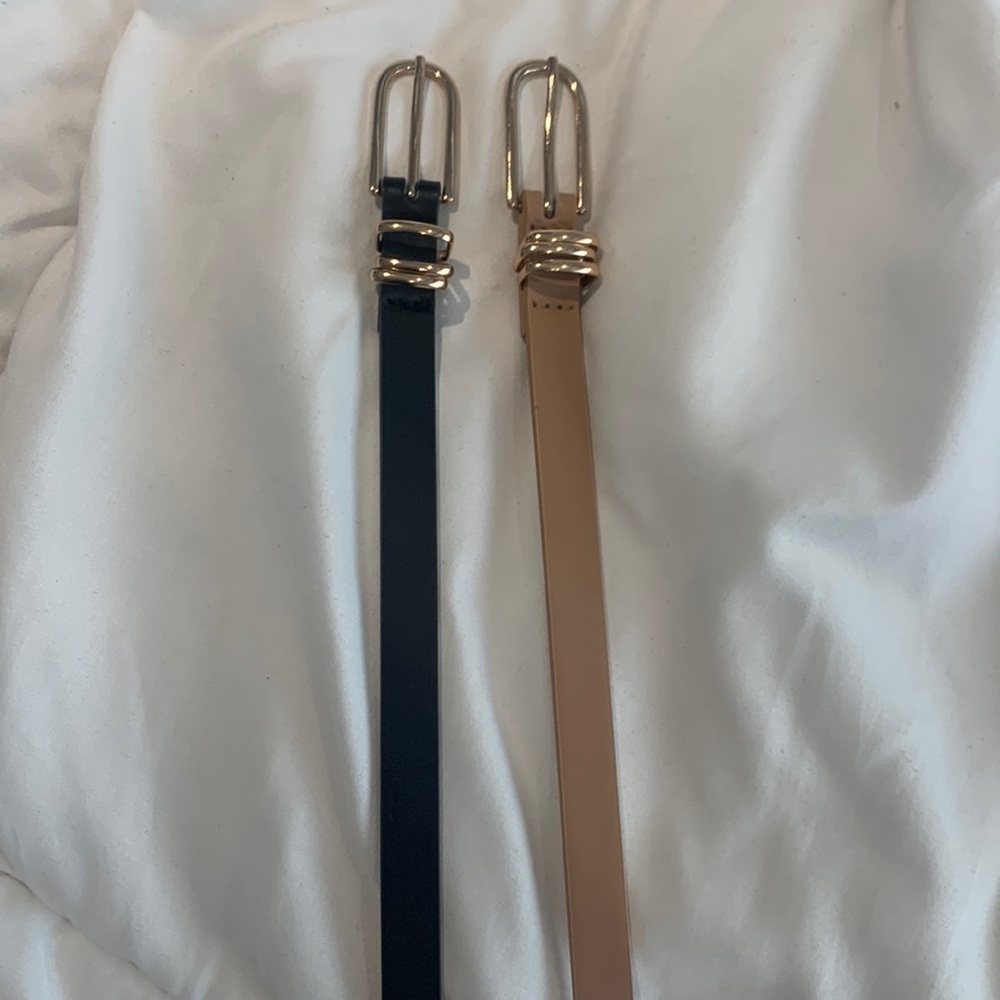 Pack of 2 skinny belts - one black, one cream - fits waist size 6
